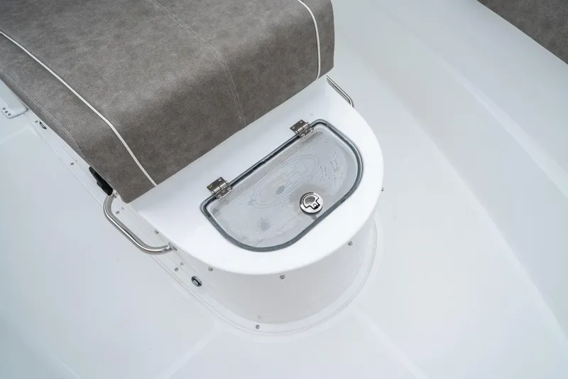 Slide: The Image of 2025 Sea Hunt Gamefish 28 CB boat seat with storage compartment. - 39