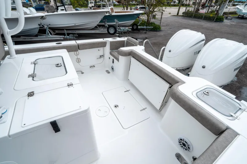 Slide: The Image of 2025 Sea Hunt Gamefish 28 CB boat interior with dual engines and storage compartments. - 11