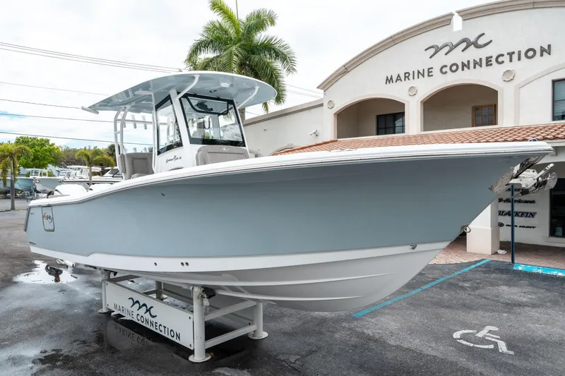 Slide: The Image of 2025 Sea Hunt Gamefish 28 CB boat displayed at Marine Connection dealership. - 8