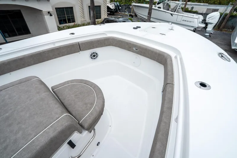 Slide: The Image of 2025 Sea Hunt Gamefish 28 CB boat interior with cushioned seating and sleek design. - 36