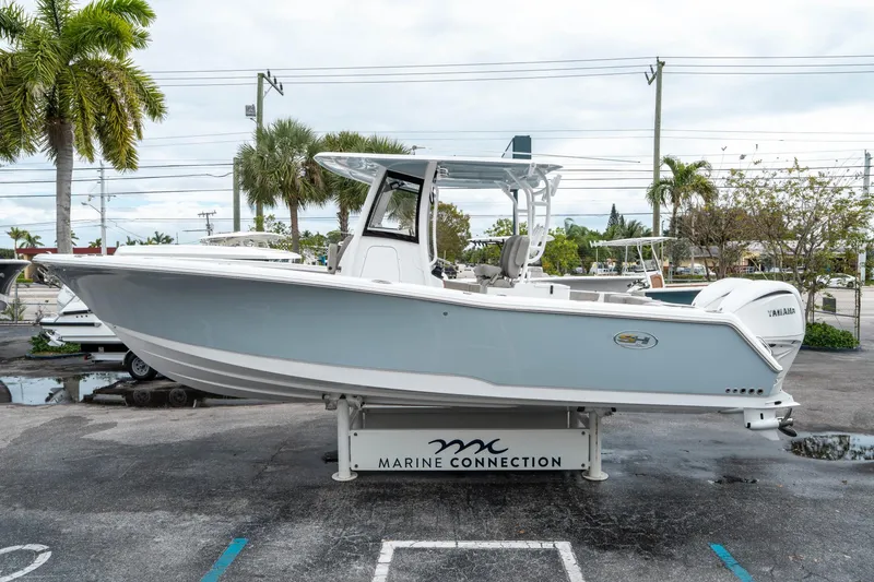 Slide: The Image of 2025 Sea Hunt Gamefish 28 CB boat displayed at Marine Connection dealership. - 5