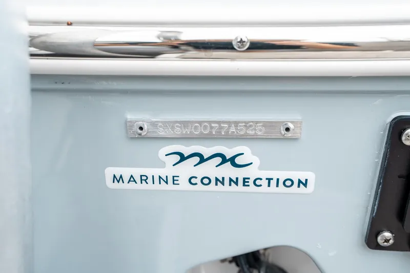 Slide: The Image of 2025 Sea Hunt Gamefish 28 CB boat with Marine Connection logo and serial number. - 44