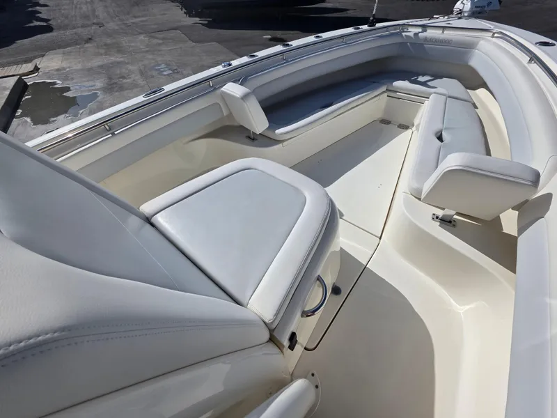 Slide: The Image of Luxurious seating area on a 2021 Blackwood 27 boat, featuring sleek white upholstery. - 14