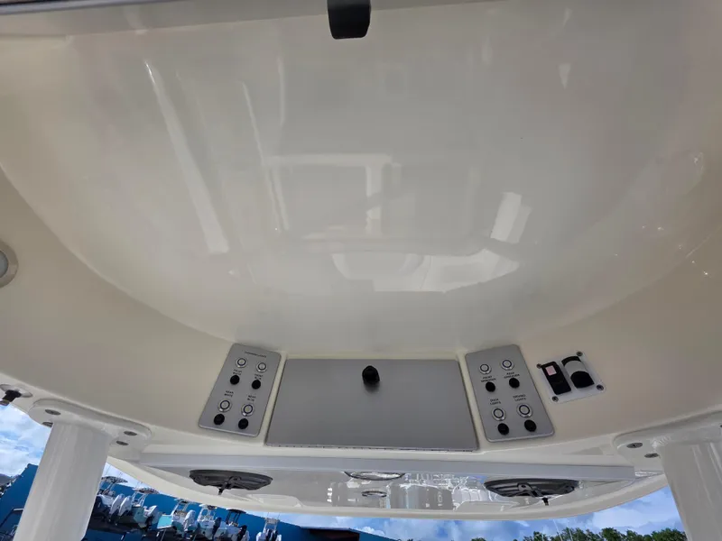 Slide: The Image of 2021 Blackwood 27 boat console with controls and speakers, viewed from below. - 23