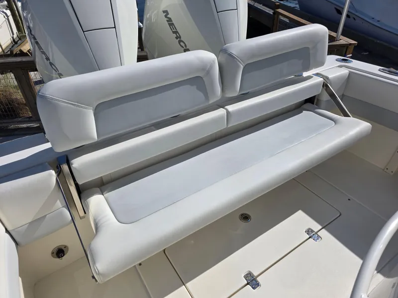 Slide: The Image of Luxury seating on a 2021 Blackwood 27 boat, featuring sleek white upholstery. - 24