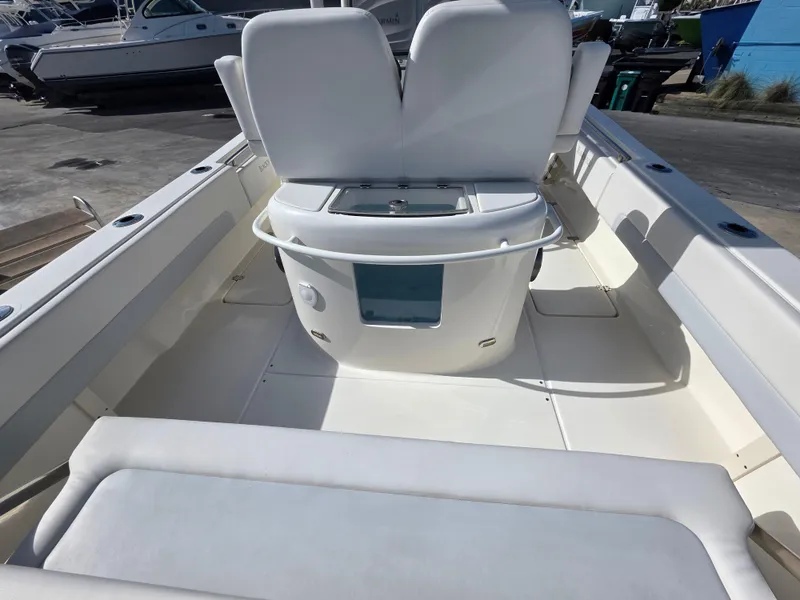 Slide: The Image of 2021 Blackwood 27 boat interior with white seating and storage area. - 26