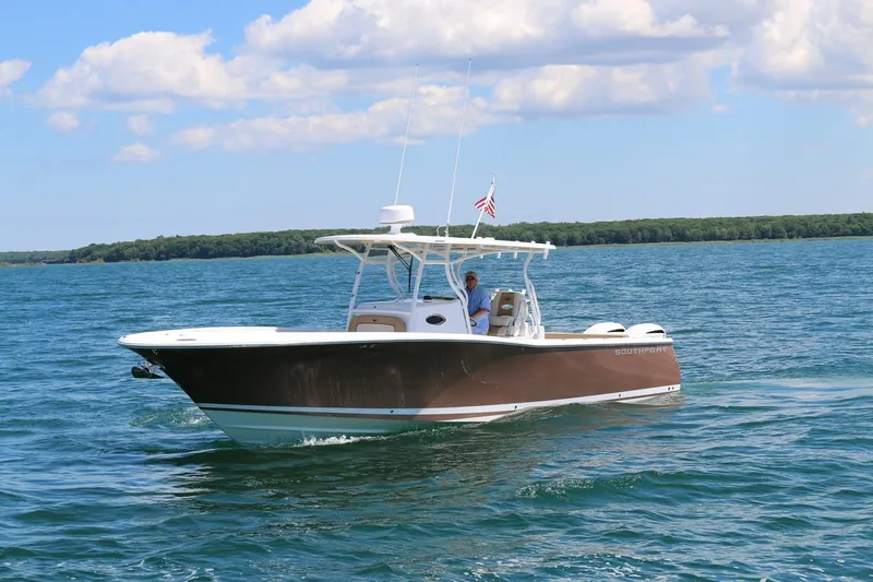 Slide: The Image of 2017 Southport 33 FE boat cruising on a sunny day with clear blue water. - 1