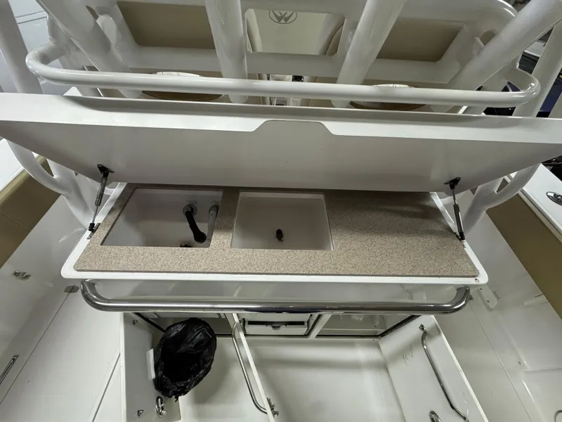Slide: The Image of 2017 Southport 33 FE boat interior with sink and storage area. - 14