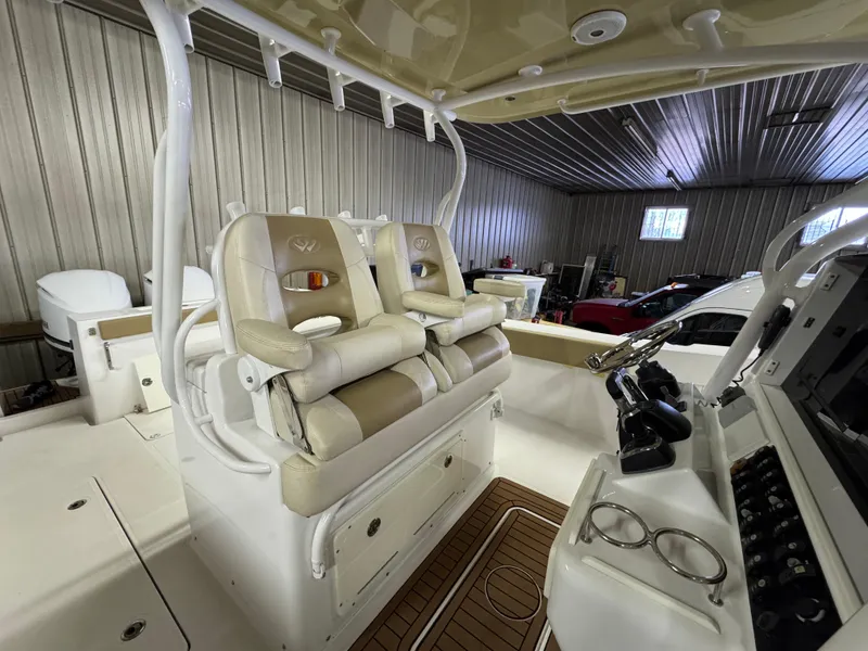 Slide: The Image of Interior of 2017 Southport 33 FE boat with beige seating and control panel. - 17