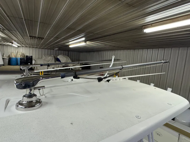 Slide: The Image of 2017 Southport 33 FE boat with fishing rod holders in a storage facility. - 35
