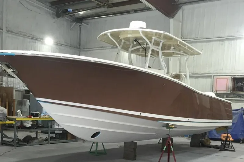 Slide: The Image of 2017 Southport 33 FE boat in a workshop setting. - 37