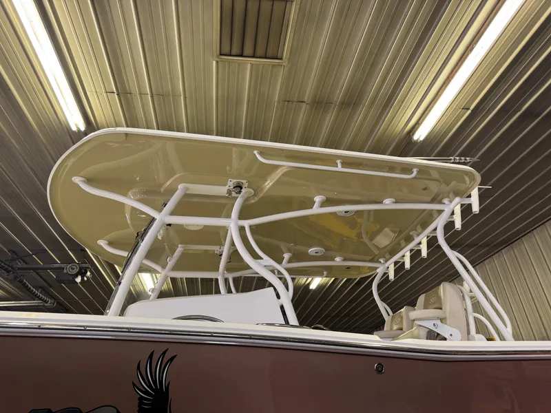 Slide: The Image of 2017 Southport 33 FE boat in a metal storage facility, showcasing its T-top structure. - 38