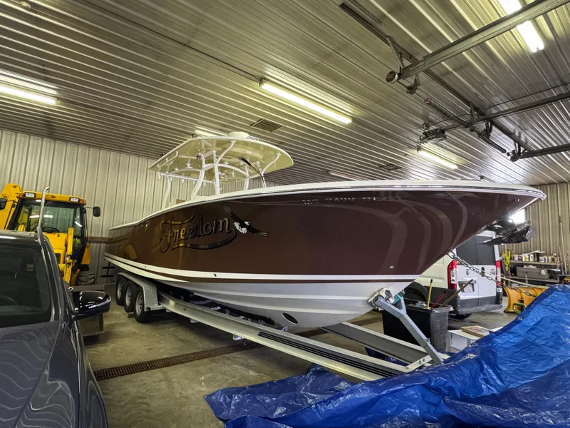 Slide: The Image of 2017 Southport 33 FE boat in a garage on a trailer. - 40