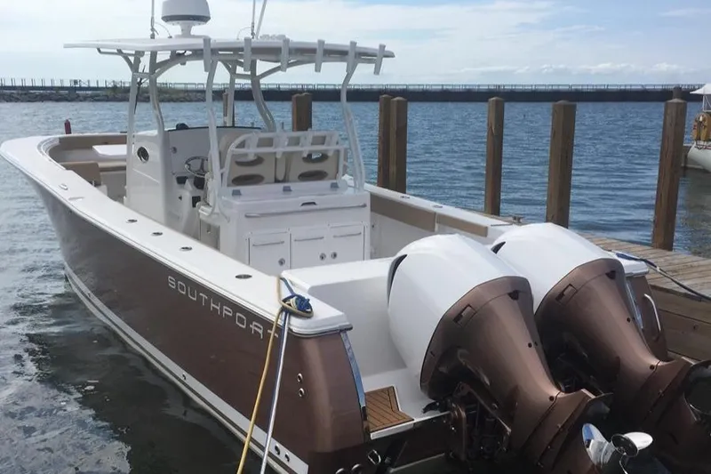 Slide: The Image of 2017 Southport 33 FE boat docked with dual outboard engines. - 5
