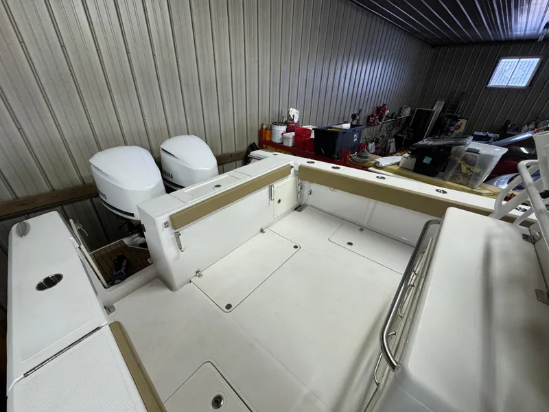 Slide: The Image of 2017 Southport 33 FE boat interior with dual engines in a storage facility. - 8