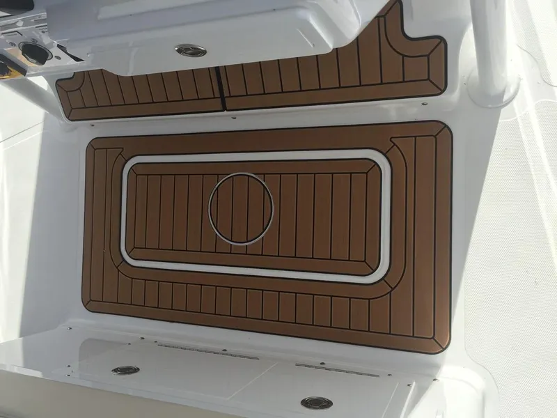 Slide: The Image of 2017 Southport 33 FE boat deck with brown and white non-slip surface. - 9