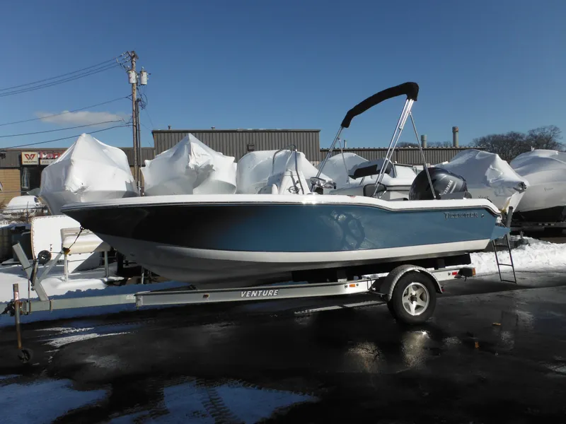 The Image of 2025 Tidewater 180 CC Adventure boat on trailer, parked outdoors in winter setting. - 0