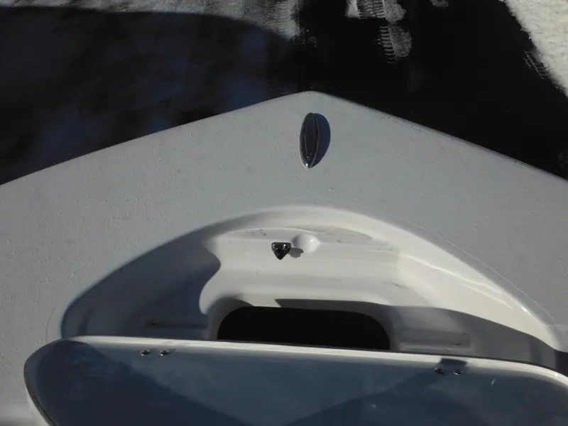 Slide: The Image of 2025 Tidewater 180 CC Adventure boat deck, featuring storage compartment. - 15