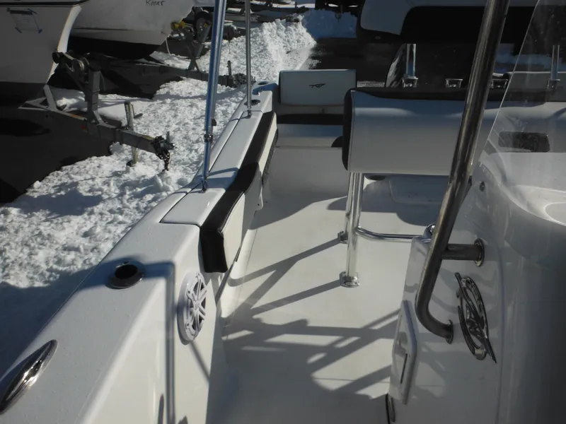 Slide: The Image of 2025 Tidewater 180 CC Adventure boat interior with seating and snow in the background. - 19