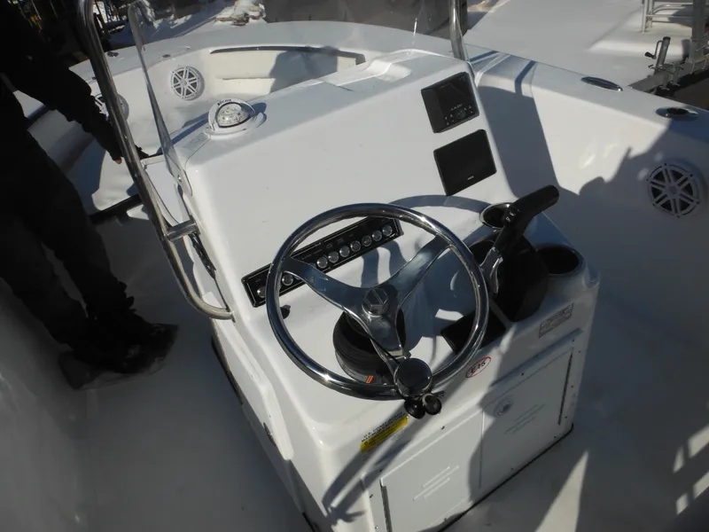 Slide: The Image of 2025 Tidewater 180 CC Adventure boat console with steering wheel and controls. - 24