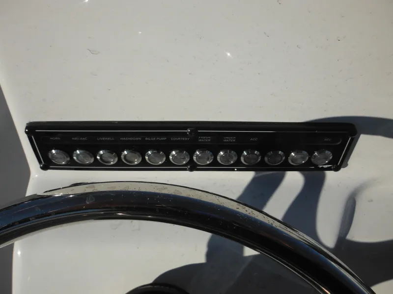 Slide: The Image of Close-up of 2025 Tidewater 180 CC Adventure boat dashboard with control panel. - 26