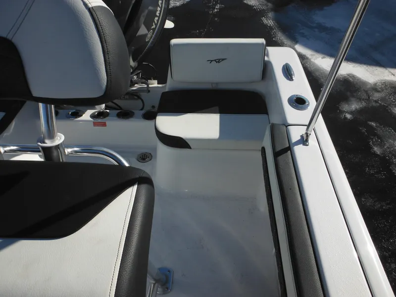 Slide: The Image of 2025 Tidewater 180 CC Adventure boat interior with seating and control panel. - 31