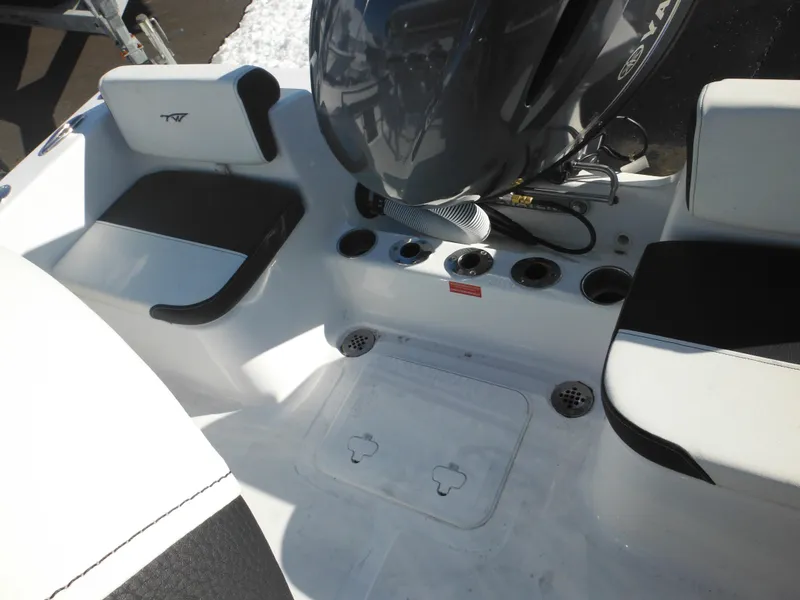 Slide: The Image of 2025 Tidewater 180 CC Adventure boat interior with seating and motor detail. - 32