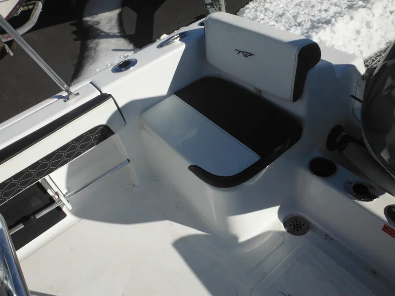 Slide: The Image of 2025 Tidewater 180 CC Adventure boat interior with seating and cup holders. - 33