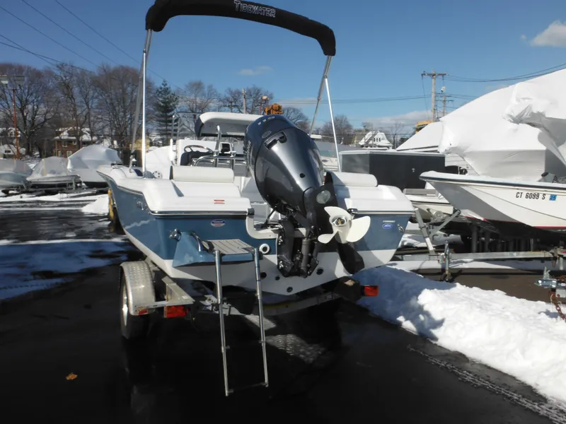 Slide: The Image of 2025 Tidewater 180 CC Adventure boat on trailer, rear view, in snowy outdoor setting. - 7