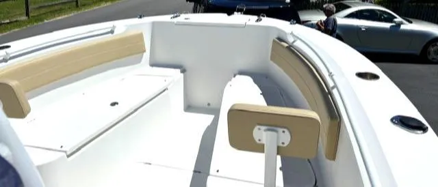Slide: The Image of 2019 Release 240 RX boat interior with beige seating and white deck. - 5