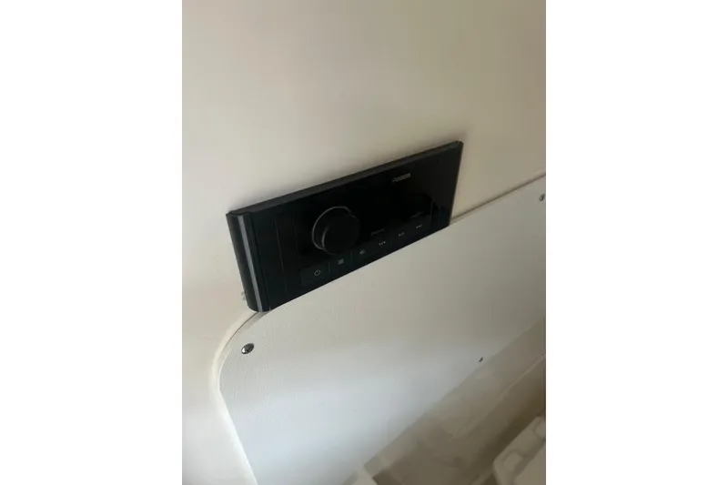 Slide: The Image of Control panel on 2016 Boston Whaler 330 Outrage boat interior. - 15