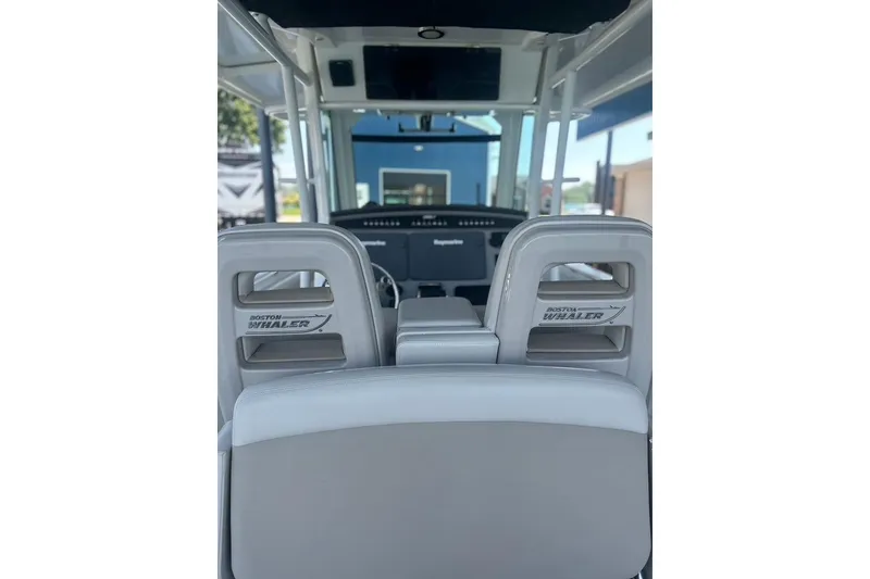 Slide: The Image of Interior view of 2016 Boston Whaler 330 Outrage boat cockpit and seating. - 20