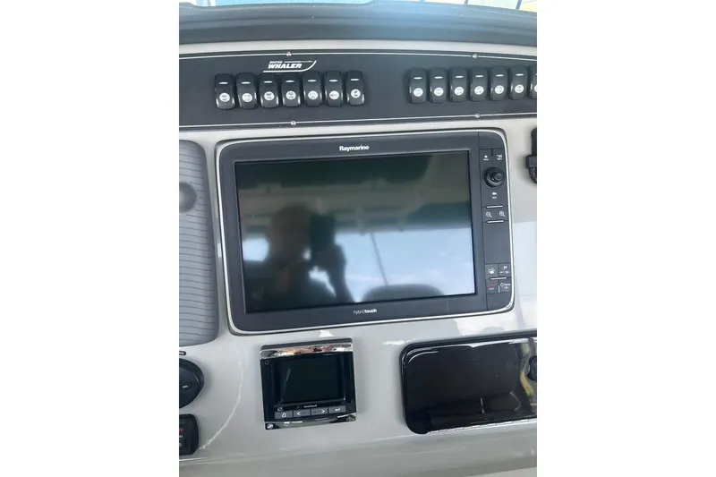 Slide: The Image of Control panel of a 2016 Boston Whaler 330 Outrage with Raymarine display. - 23