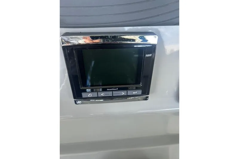 Slide: The Image of Control panel on a 2016 Boston Whaler 330 Outrage boat dashboard. - 25