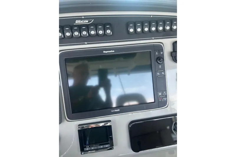 Slide: The Image of Control panel of 2016 Boston Whaler 330 Outrage with Raymarine display. - 26