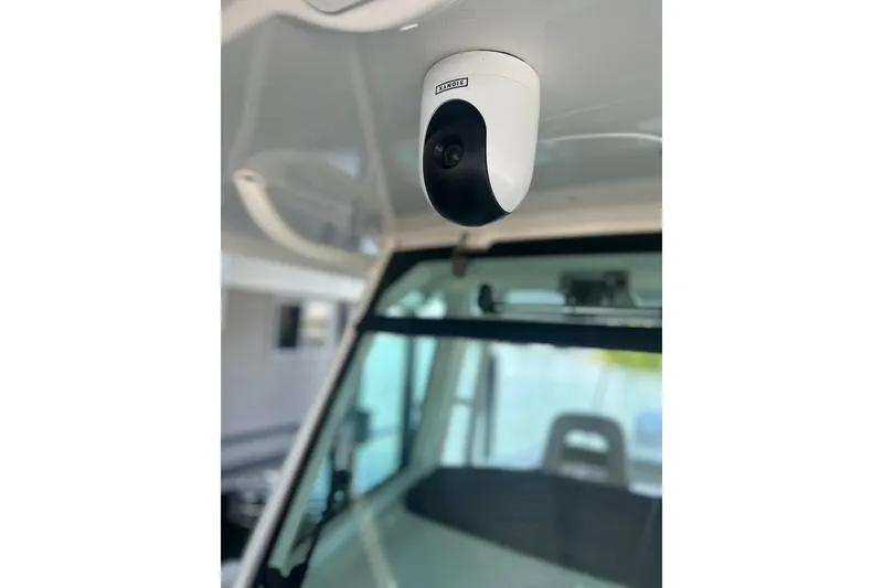 Slide: The Image of Security camera inside 2016 Boston Whaler 330 Outrage boat, focused on interior details. - 36