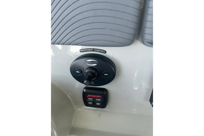 Slide: The Image of Spotlight control panel on 2016 Boston Whaler 330 Outrage boat dashboard. - 37