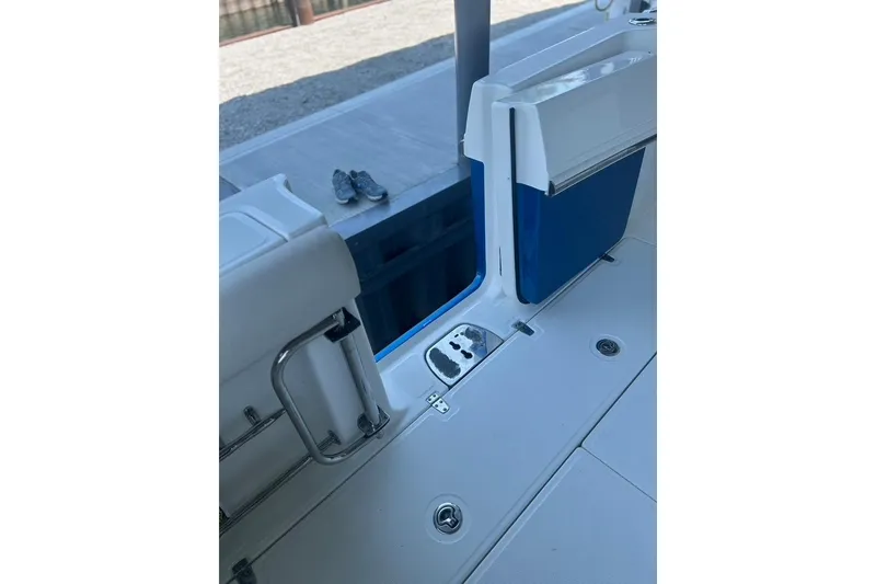 Slide: The Image of 2016 Boston Whaler 330 Outrage boat interior with seating and deck details. - 38