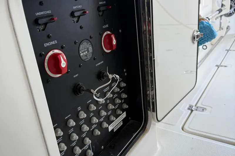 Slide: The Image of Electrical panel on a 2016 Boston Whaler 330 Outrage boat, showing switches and controls. - 4