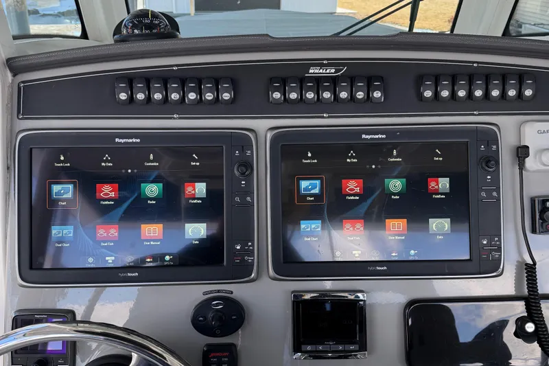 Slide: The Image of Control panel of 2016 Boston Whaler 330 Outrage with dual Raymarine displays. - 6
