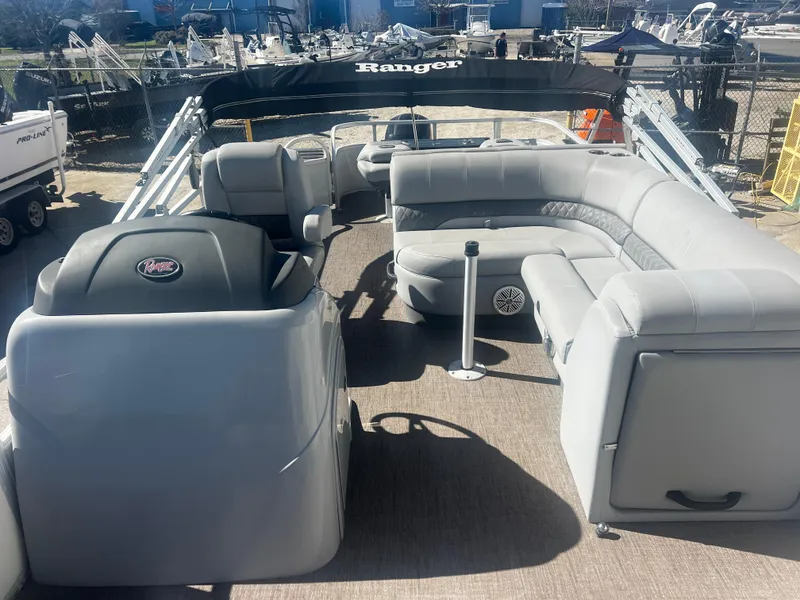 Slide: The Image of 2019 Ranger Reata 223F pontoon boat with spacious seating and modern design. - 6