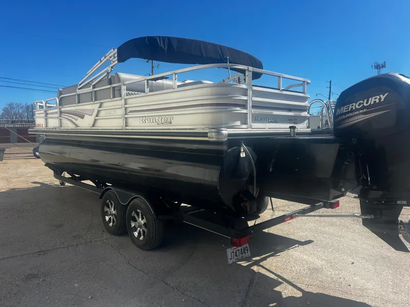 Slide: The Image of 2019 Ranger Reata 223F pontoon boat with Mercury outboard motor on trailer. - 9