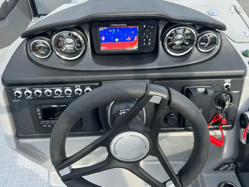 Slide: The Image of Dashboard of 2025 Berkshire 22RFX ARCH CTS 2.75 boat with steering wheel and navigation system. - 15