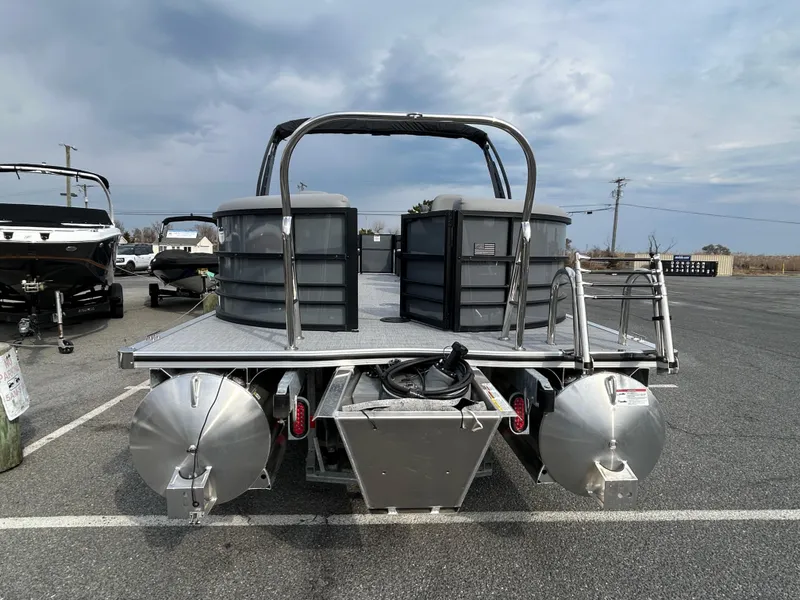 Slide: The Image of 2025 Berkshire 22RFX ARCH CTS 2.75 pontoon boat, rear view in parking lot. - 16