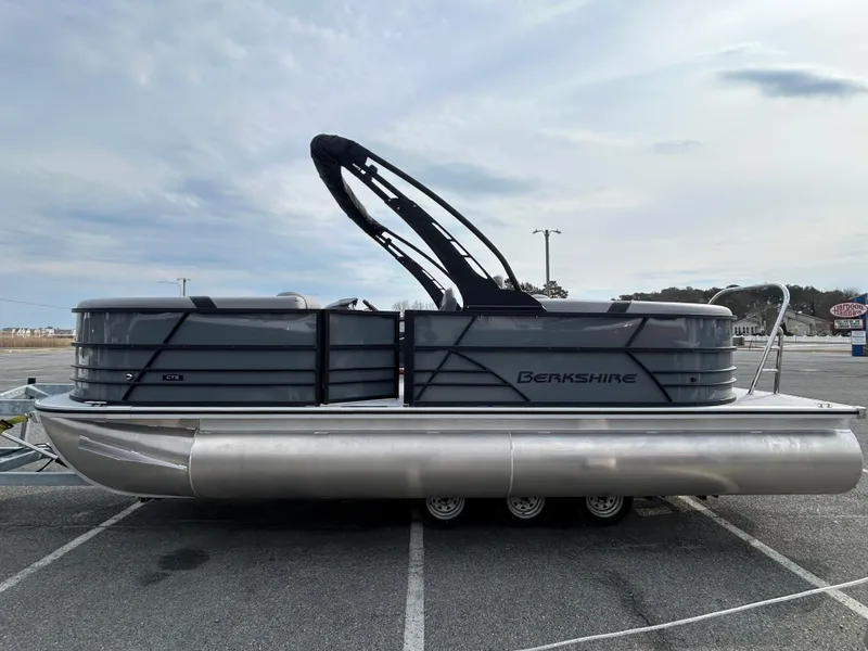 Slide: The Image of 2025 Berkshire 22RFX ARCH CTS 2.75 pontoon boat parked in a lot. - 3