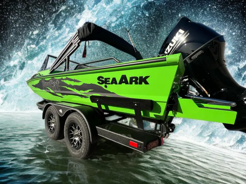 Slide: The Image of 2025 SeaArk ProCat 200 boat in vibrant green on a trailer, parked outdoors. - 2