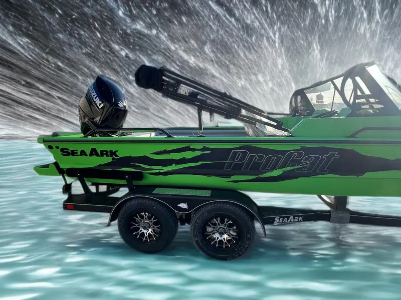 Slide: The Image of 2025 SeaArk ProCat 200 in vibrant green on water with Suzuki engine. - 4