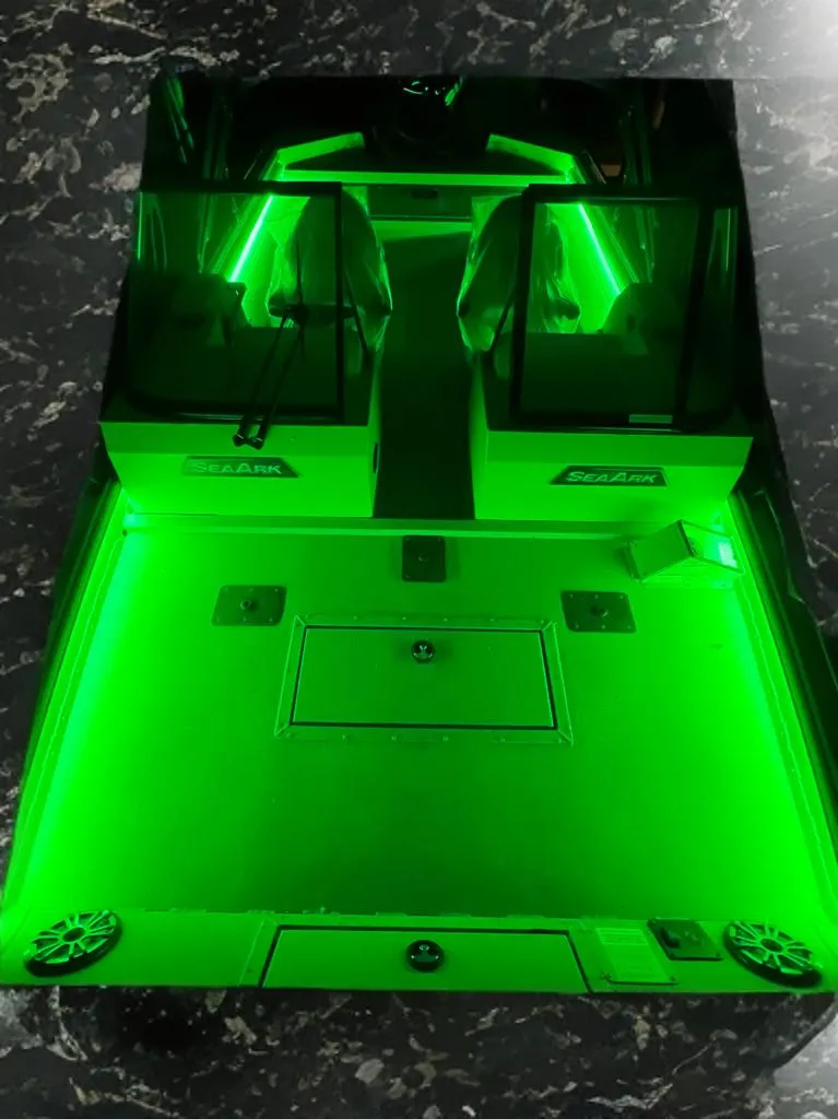 Slide: The Image of 2025 SeaArk ProCat 200 boat on water, featuring vibrant green design and powerful motor. - 5