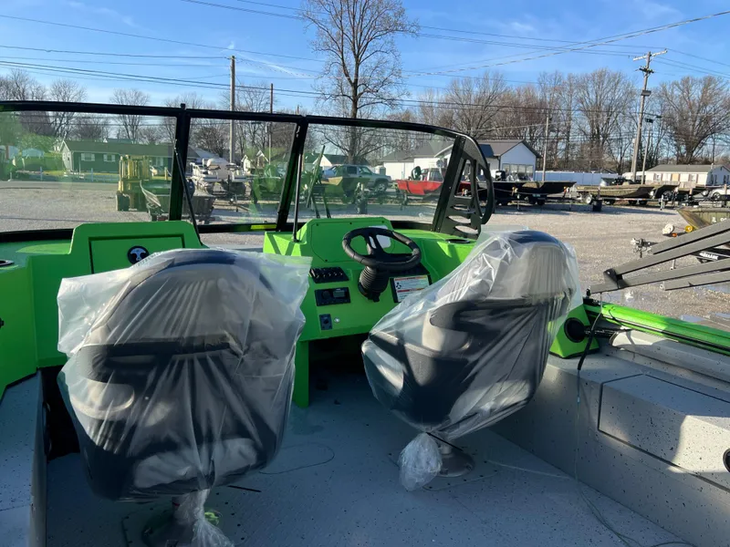 Slide: The Image of 2025 SeaArk ProCat 200 boat interior with green dashboard and wrapped seats. - 9