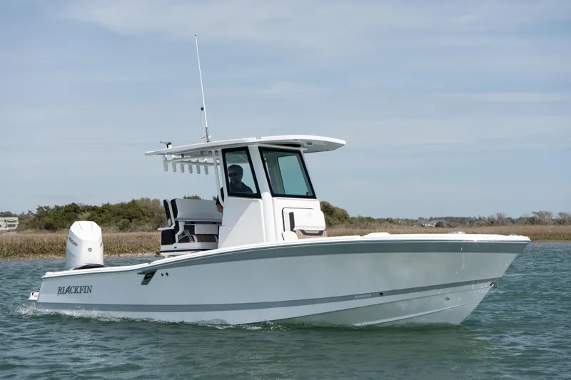 Slide: The Image of 2025 Blackfin 262 HB boat cruising on water, side view. - 4